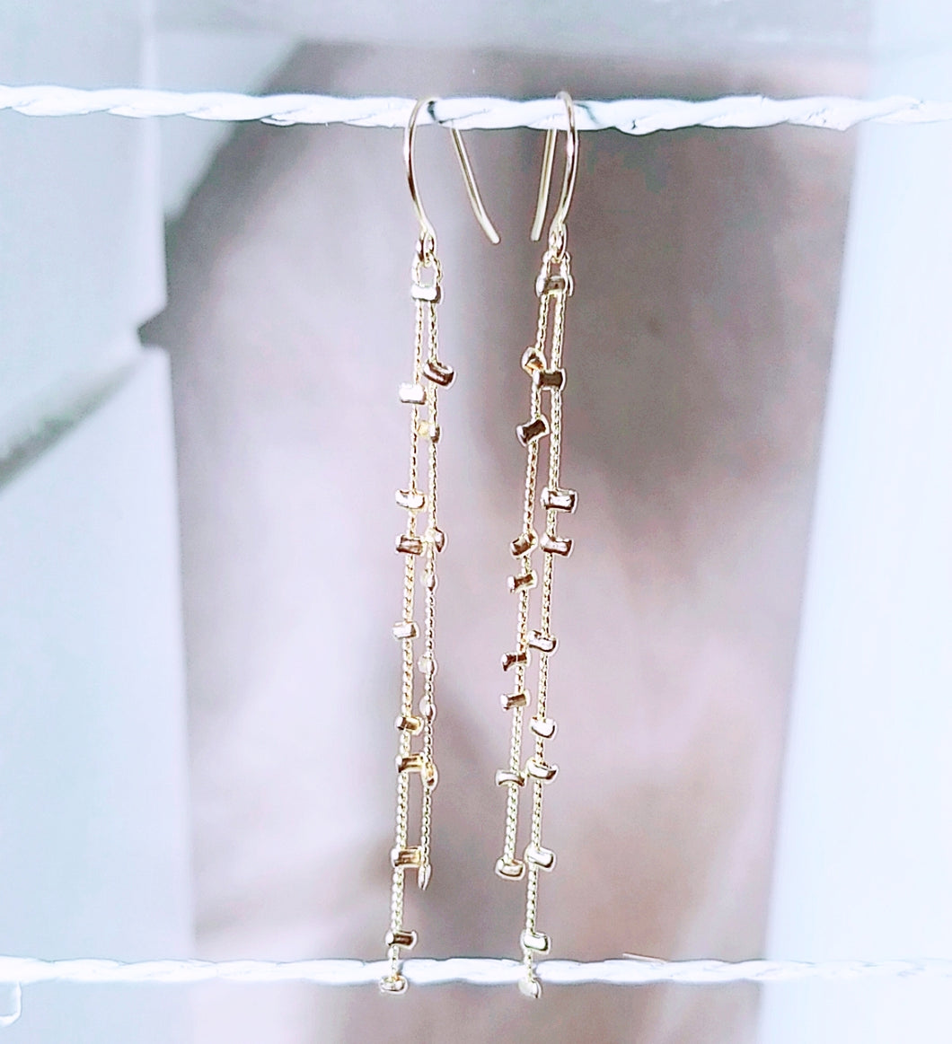 Two low gold mini bead dangle earring