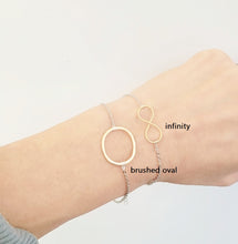 Load image into Gallery viewer, Two tone Infinity bracelet / Two tone brushed oval bracelet
